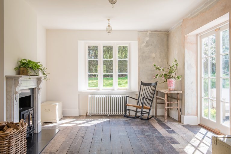Sitting room with bare plaster walls original exposed floorboards - BROOK LODGE HAMPSHIRE, SO24Shootfactory - London Location House