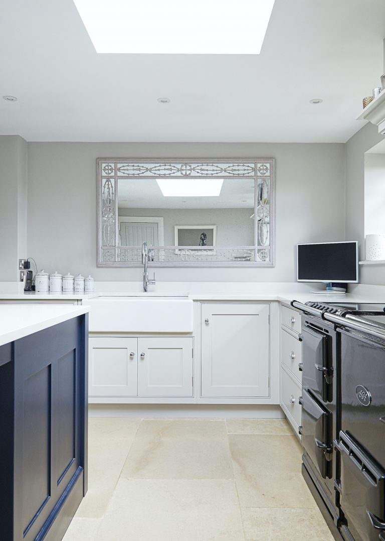 Wisteria House kitchen showing butler sink with mirror above