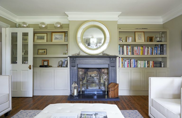 Wisteria House reception one with open fireplace and mirror above