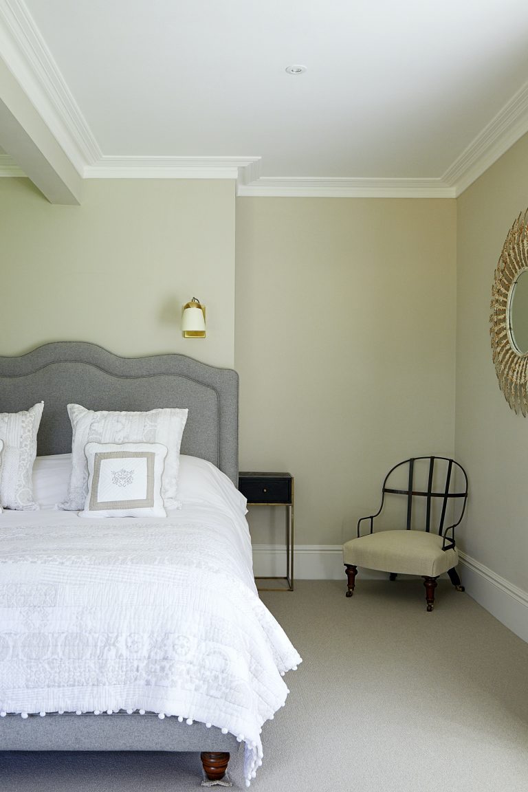 Wisteria House master bedroom with upholstered bed
