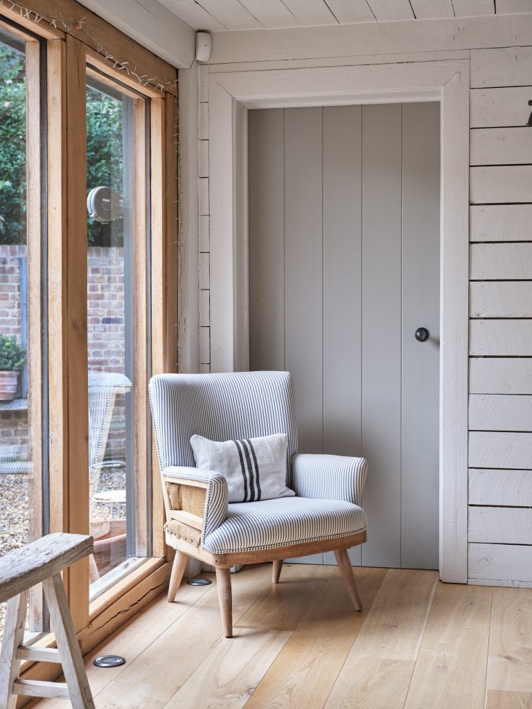 WOOD PANELLED ROOM WITH RUSTIC CHAIR AND FLOOR TO CEILING WINDOW - HAGUE BARN HENLEY ON THAMES, RG9 - SHOOTFACTORY - OTHER UK LOCATION HOUSE
