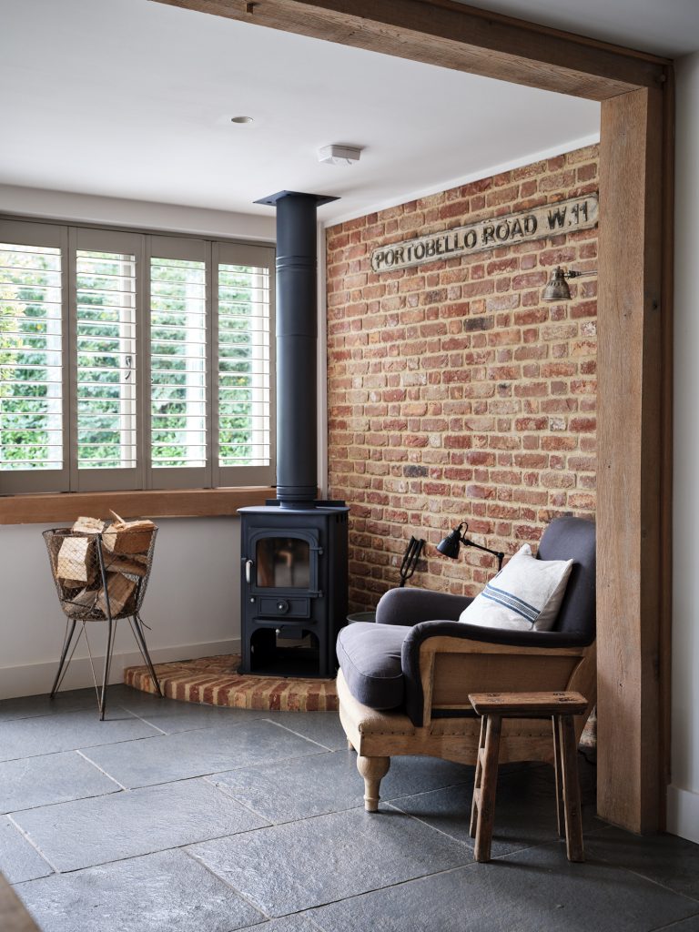 LOG BURNING STOVE AND RUSTIC CHAIR - HAGUE BARN HENLEY ON THAMES, RG9 - SHOOTFACTORY - OTHER UK LOCATION HOUSE