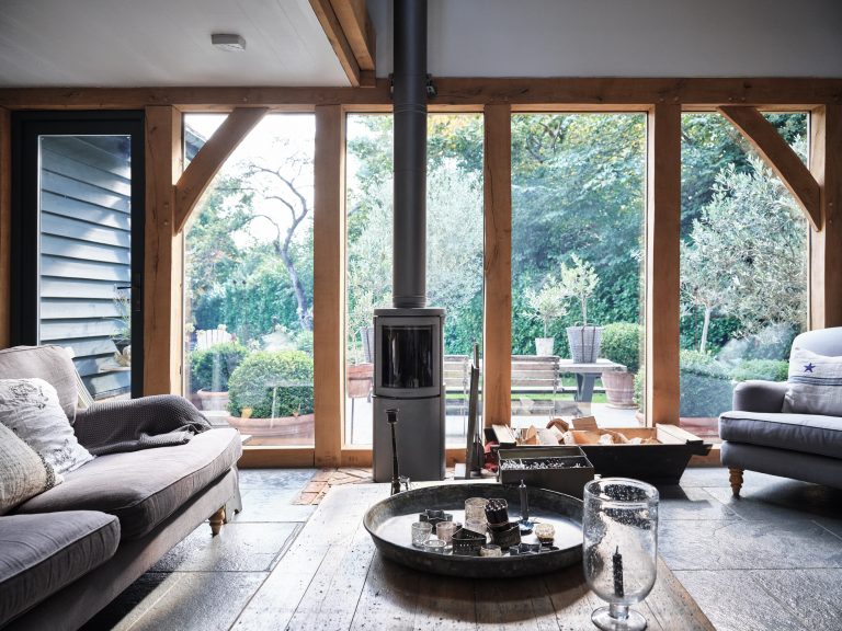 FLOOR TO CEILING LOUNGE WINDOW WITH LOG BURNING STOVE - HAGUE BARN HENLEY ON THAMES, RG9 - SHOOTFACTORY - OTHER UK LOCATION HOUSE