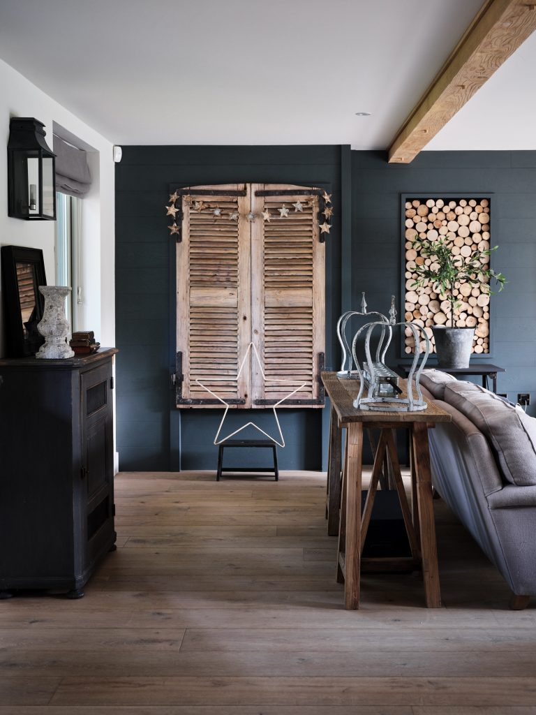 WALL MOUNTED WOODEN SHUTTERS WITHIN RUSTIC SITTING ROOM - HAGUE BARN HENLEY ON THAMES, RG9 - SHOOTFACTORY - OTHER UK LOCATION HOUSE