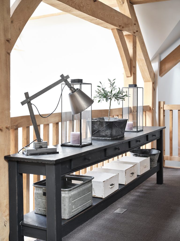 CONSOLE TABLE WITH RUSTIC HOME ACCESSORIES AND OAK FRAMED BARN - HAGUE BARN HENLEY ON THAMES, RG9 - SHOOTFACTORY - OTHER UK LOCATION HOUSE