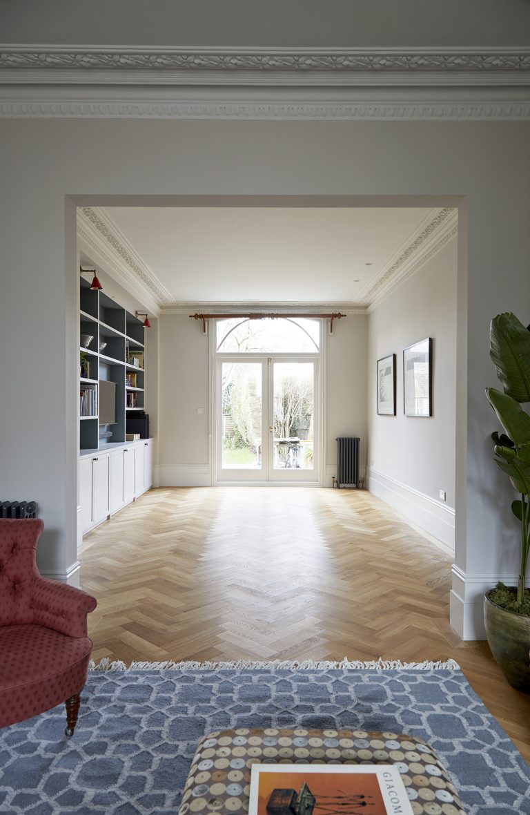 Open plan sitting room with parquet flooring and French doors that open to the garden - Melrose SW18 - Shootfactory - London Location House