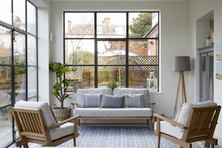 Sitting area with steel framed brittle doors that over look the garden - Melrose SW18 - Shootfactory - London-location-house