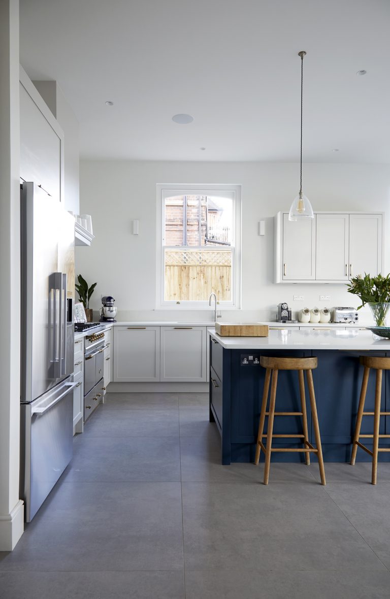 White kitchen with blue kitchen island - Melrose SW18 - Shootfactory - London Location House