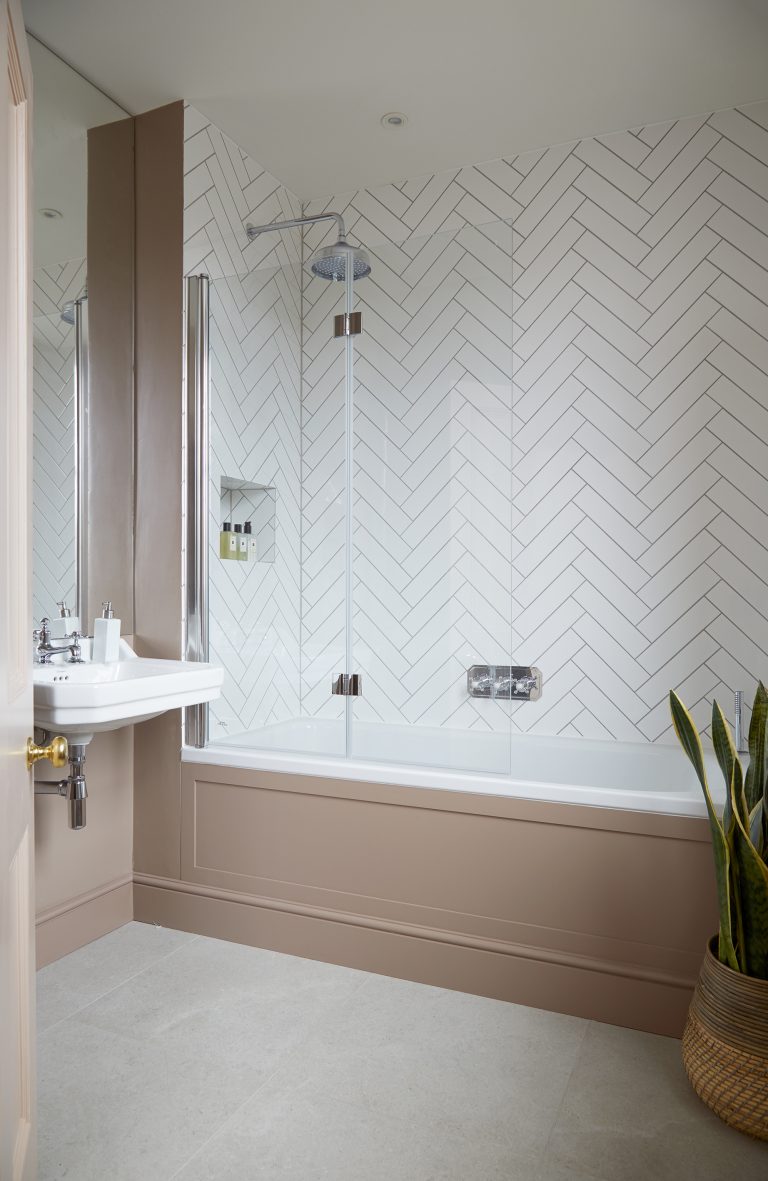 Bathroom with white herringbone tiles- Melrose SW18 - Shootfactory - London Location House